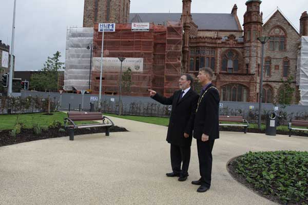 The Mayor of Derry City Centre shows Minister McCausland around the Guildhall Urban Park in Londonderry